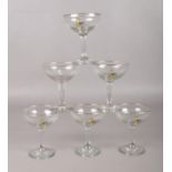 A set of six vintage Babycham glasses. Each glass has the Babycham faun and blue lettering to the