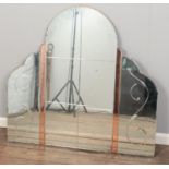 A large art deco over mantel mirror with peach glass columns.