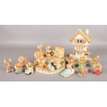 A quantity of Pendelfin figures. To include stepped log display stand, 'Castle Tavern', piano, '