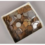 A box of British pre decimal coins. Including silver examples, 1807 half penny, etc.