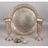A small collection of white metal and silver plated items. To include a charger decorated with