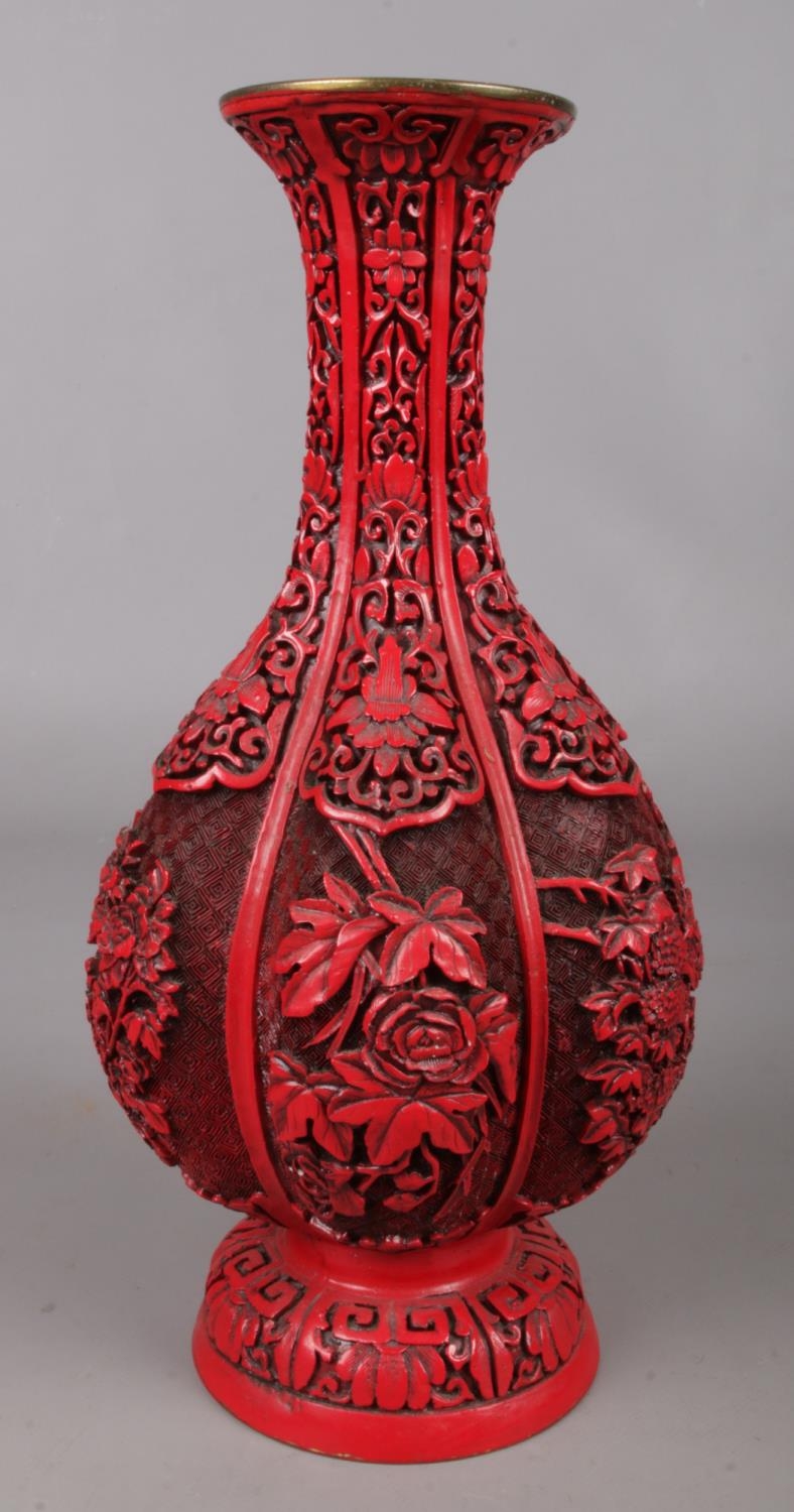 A Chinese cinnabar lacquer style fluted vase. 32cm.