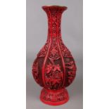 A Chinese cinnabar lacquer style fluted vase. 32cm.