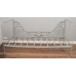 A folding metal French day bed, raised on casters. 186cm wide, 95cm high, 89cm deep. Crack to the