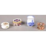 Four miniature ceramics. Including Royal Crown Derby pill boxes, Royal Doulton blue & white jug,