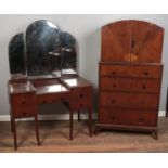 An Art Deco mahogany three piece bedroom suite. Comprising of double wardrobe, tallboy and a