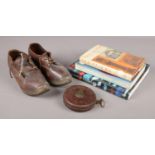 A box of miscellaneous. Includes Chesterman tape measure, Redfern shoes and collectors guides on