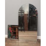 Two mirrors. To include a tulip design mirror and an arch shaped wall mirror. Largest: H:106cm W: