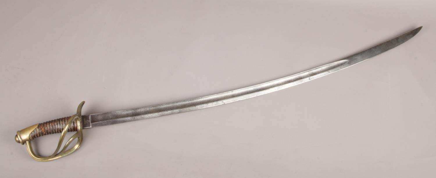 A French Cavalry troopers sword, 1822 light cavalry type, with 89cm curved blade. Knight's head