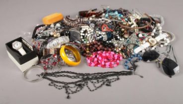 A quantity of costume jewellery. Beads, bangles, quartz wristwatches etc