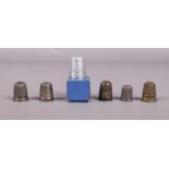 A selection of six thimbles, one boxed and two silver. To include a thimble assayed in Chester