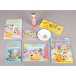 A collection of vintage toys, games and books focusing on The Magic Roundabout and Noddy.
