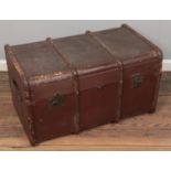 A vintage travel trunk with wooden bounding.