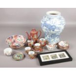 A collection of oriental ceramics and collectables. Includes large blue and white vase, cloisonné