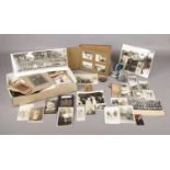 A box of assorted early 20th century photographs and album. Comprising of a glass plate photograph