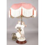 A Capodimonte style table lamp by Berger. With shade, 59cm height.