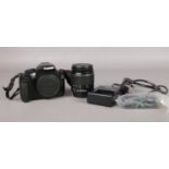 A Canon EOS 1100D digital SLR camera and accessories. To include a EFS18-55mm lens and battery