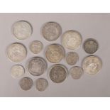 A collection of British silver coins. Includes George III 1820 and Victorian 1887 and 1894