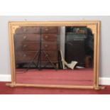 A large painted over mantle mirror. H: 82cm W: 110cm. Some minor chips to frame. Mirrored glass