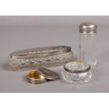 A selection of silver and glass vanity objects. To include a silver topped jar assayed in London