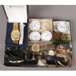 A tray of watches and pocket watch movements. Includes Marvin and Lucerne fob watches, ladies and