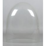 A large clock glass dome of oval form with rounded edges, missing plinth. Height: 41cm, Width: 33cm,
