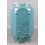 A Chinese hexagonal pottery seat in a blue glaze with prunus blossom decoration. Height 47cm.