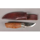 A Norwegian Brusletto hunting or bush craft knife with leather scabbard with a Walnut grip and