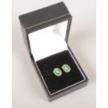 A pair of 9ct gold malachite ear studs. 1.89g.