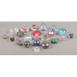 A large collection of glass paperweights, to include Ditchfield style and millefiori examples.