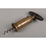 A Thomason style corkscrew with brass cylinder and turned wooden handle. Lacking brush.