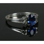 A white metal sapphire & diamond ring, size M. 1.95g.