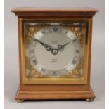 A mahogany cased Elliott London mantle clock, inscribed 'W. Mansell, Lincoln' to the dial. 15cm
