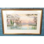 A Douglas Haddow (20th Century) framed landscape watercolour. Titled: Norfolk Sunrise, signed by the