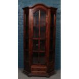 A stained Pine glazed corner cupboard (187cm height 102cm width 45cm depth)