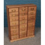 A stripped oak multi drawer chest. (74.5cm x 56.5cm)