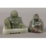 Two small seated Buddhas. Comprising of one Buddha in bronze and the other in spinach Jade on