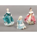 Three Royal Doulton figurines. 'Alice' HN 2158, ' Southern Belle' HN 2229, 'Janine' HN 2461.