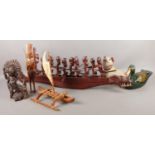 A collection of treen, mainly carved items. To include large tribal boat, complete with rowers and