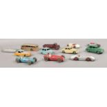 Twelve vintage Dinky Toy vehicles. To include No 40A Riley Saloon, No. 413/30S Austin wagon, No.