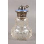 A glass atomiser perfume bottle with silver & enamel top. 12cm height.