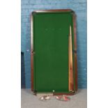 A small table top slate snooker table with accessories. 162cm x 86cm.