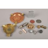 A small tray of trench art and military buttons. To include two brass and copper ashtrays, small