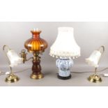 Four table lights, to include a pair of brass coloured examples with frilled glass shades and an