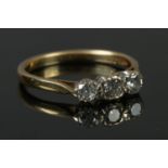 A 18ct gold three stone diamond ring (0.5 carat total) size N. 2.69g.