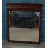 A mahogany wall mirror. (66cm x 55cm)