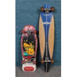Two vintage skateboards. An imported USA Tru Toys High Flyer Skateboard and a Osprey surfboard