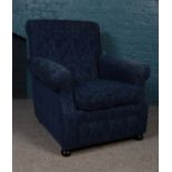 A blue upholstered armchair. (101cm height 92cm width 84cm depth)