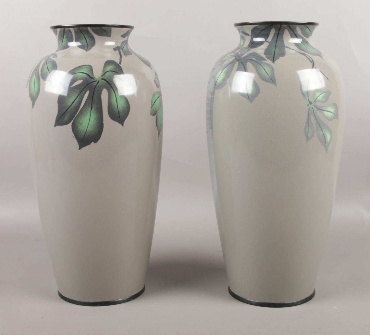 A pair of enamel decorative vases. (35.5cm height) To include cut crystal glass ware. chip to enamel