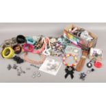 A quantity of costume jewellery. Bangles, beads, earrings etc